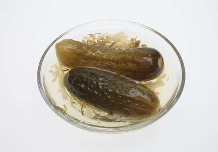 pickled cucumber or sour gherkin over whiteの写真素材