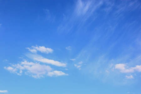 blue sky with some white clouds in summerの写真素材