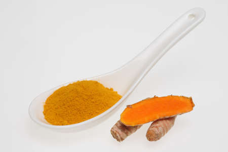 Turmeric, Curcuma longa, a rhizomatous herbaceous perennial plant as spice and medicinal herbの写真素材