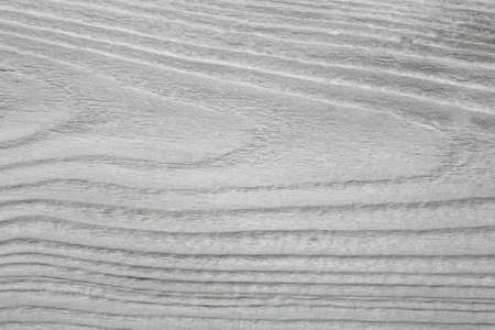 old, whitewashed, wooden board as a backgroundの写真素材