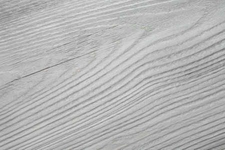 old, whitewashed, wooden board as a backgroundの写真素材