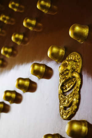 RED DOOR WITH GOLDEN LION AND BUTTIONS IN THE TEMPLE OF HEAVENの写真素材
