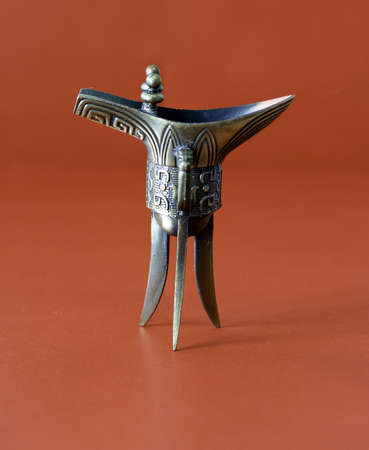 a Chinese ancient winecup on the tableの写真素材