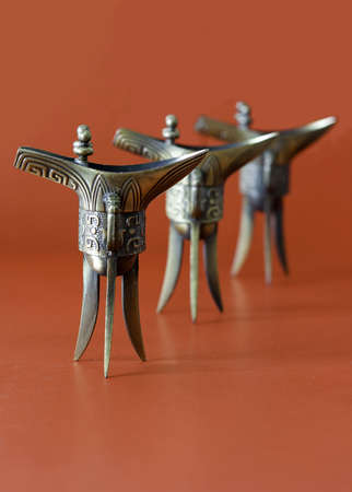 Three Chinese ancient winecup on the tableの写真素材