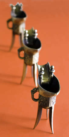 Three Chinese ancient winecup on the tableの写真素材
