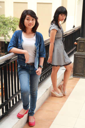 two beautiful smiling young girlsの写真素材