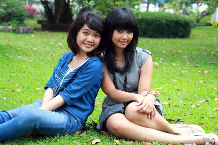 two beautiful smiling young girlsの写真素材