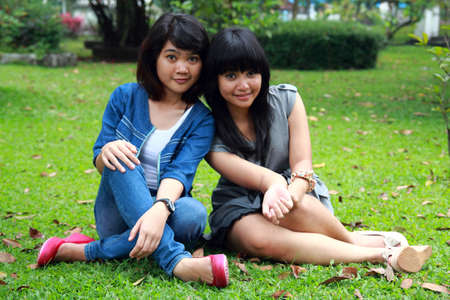 two beautiful smiling young girlsの写真素材