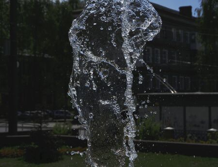 Water stream splashing on ground.from the fountainの写真素材