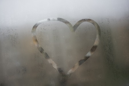 Autumn rain, the inscription on the sweaty glass - love and heartの写真素材