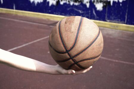 Basketball ball in handの写真素材