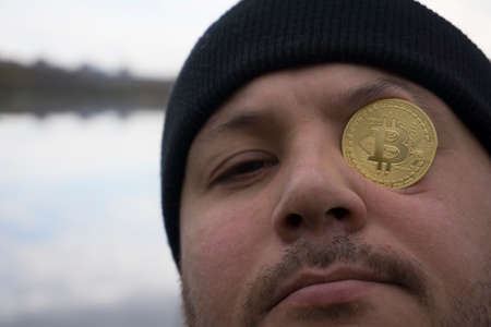 a serious man with bitcoin (new virtual money )の写真素材