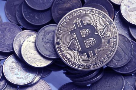 One Bitcoin on Russian banknotes. Closeup, macro shotの写真素材