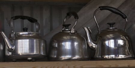 Classic shiny kettle with black handleの写真素材