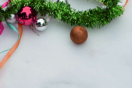 Christmas light frame decorated with red and white baubles, bows and fir branches. Copy space in the centerの写真素材