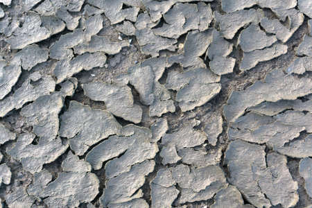 texture of the crackled red clay in the desertの写真素材