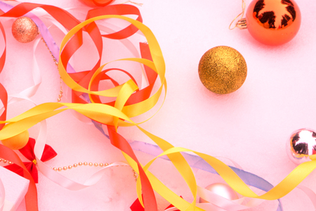 Red and yellow Christmas balls on the background in the snow.の写真素材