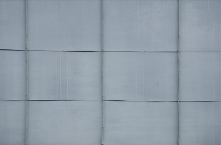 Gray tile roof floor background. Closeup roofing texture pattern. Materials to build a house for sun and rain protection. White backdrop with top rays light.の写真素材