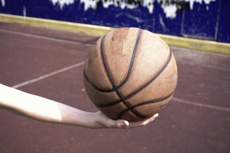 Basketball ball in handの写真素材