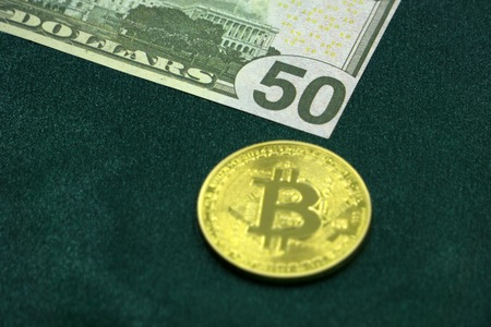 new virtual money and banknote one dollar. Exchange bitcoin for dollars. the world of digital cryptocurrency and payment systemの写真素材