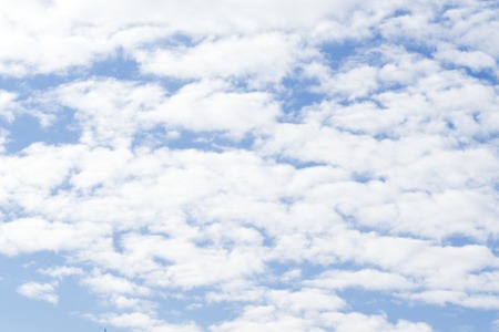 Beautiful blue sky, white clouds with sun flare. Nature background