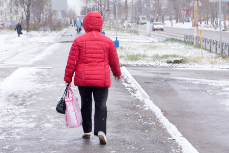 girl walking on the street in winterの写真素材