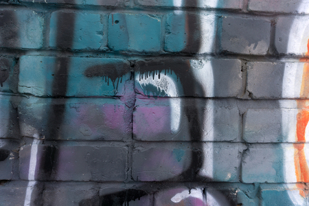 Old brick wall from a multi-colored brickの写真素材