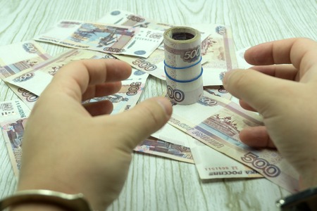 business woman gives money to bribe closeupの写真素材