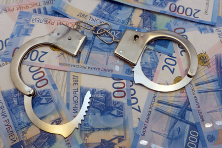 The handcuffs are on the Russian banknotesの写真素材