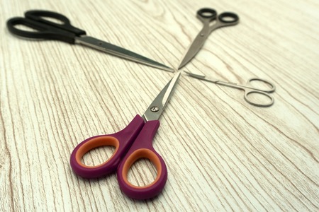 Professional haircutting scissors isolated on white background. Silver metal, stainless steel scissorsの写真素材