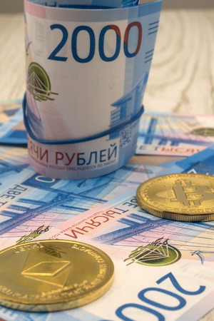 Bitcoin digital crypto token currency macro close up standing up with US one hundred dollar billの写真素材