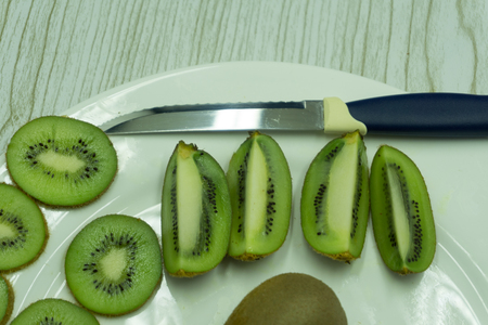 Isolated kiwi. Collection of whole and cut kiwi fruits isolated on white background with clipping pathの写真素材