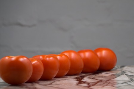 tomatoes on a white wooden table, pasta ingredients top view copy space
