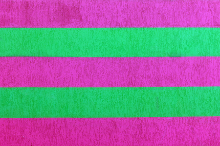 Textured brick wall with bright multicolored vertical stripes of green, blue, vilet and pink, abstract background. Concept of graphite walls, urban culture, aerosol picturesの写真素材