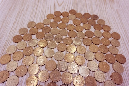 coin in quarter dollar against the background of the Russian coins in 5 rublesの写真素材