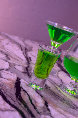 Absinthe shots on grey stone background top view copy spaceの写真素材