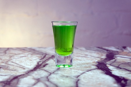 cocktail splash in glass isolated on blackの写真素材