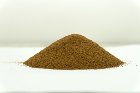 Top view of roast ground coffee isolated on white .の写真素材