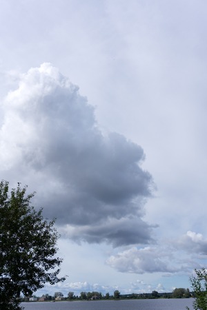 Evening storm over watershed and dramatic sky and cloudsの写真素材