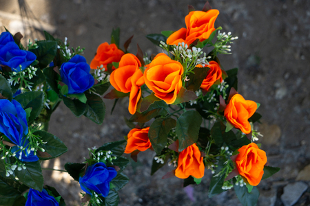 The image of a bouquet of artificial poppies in a vase, isolated, on a white backgroundの写真素材