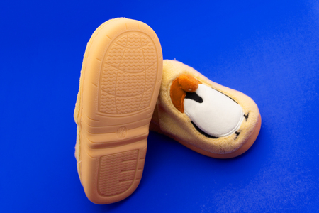 A pair of pink slippers on a white backgroundの写真素材