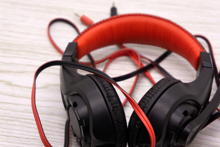 Black headphones on dark wooden background. Vintage styleの写真素材