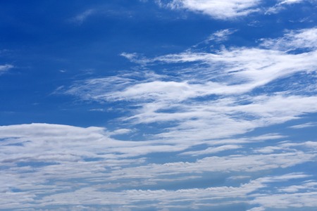 White cumulus clouds in blue sky at daytime. Natural background photo texture .