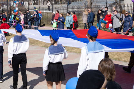 Russia Berezniki - 01.05.2018 . 2018 FIFA world Cup. Flags of Russia and Tunisia hang on wall of on Nikolskaya street in flag depicts big bear and there isのeditorial素材