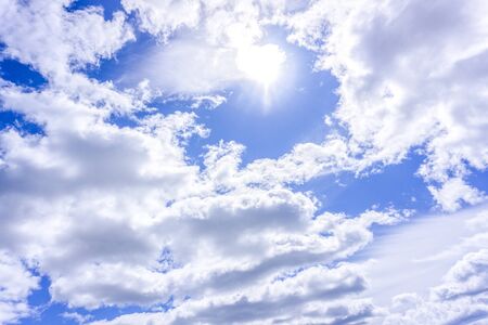 Light blue sky with clouds, may be used as background
