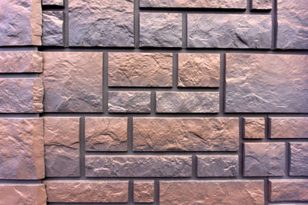 Decorative wall under a stone. Background texture