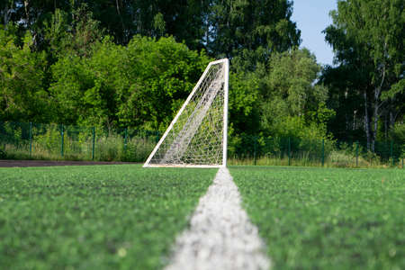 Goal with net stand on a soccer or football fieldの写真素材