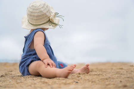 asian baby on the beachの写真素材