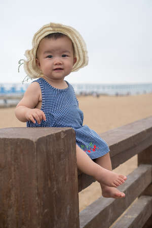 asian baby on the beachの写真素材