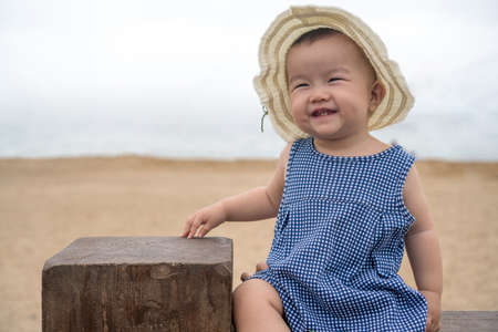 asian baby on the beachの写真素材
